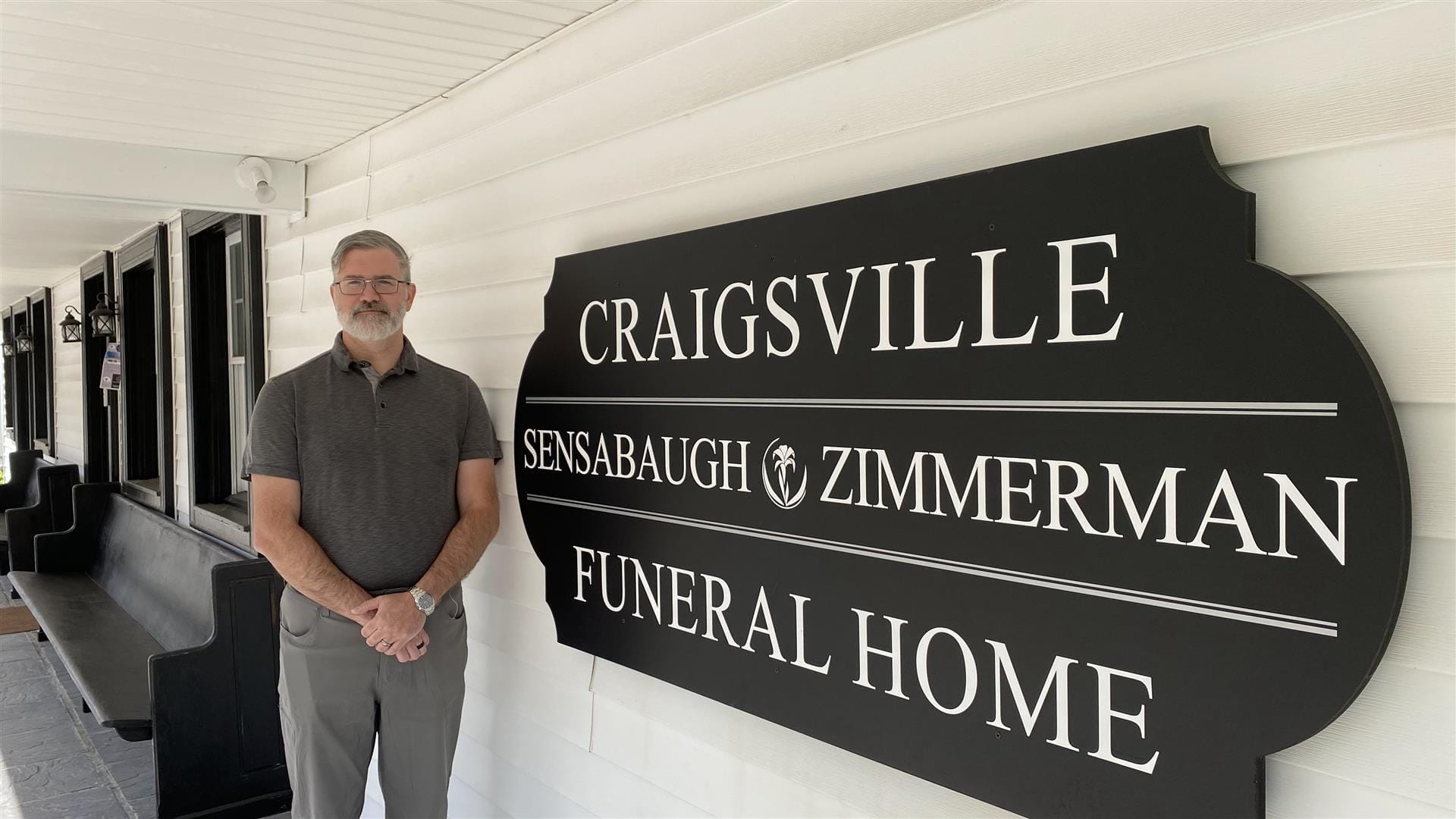 Garland with the historical Craigsville Funeral Home sign